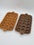 An original set of two large, heavy ceramic baking dishes, featuring a distinctive vintage style. Each pan features 18...