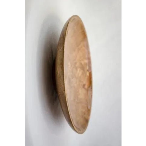 This is a Maple Burl plate with a high gloss finish. It's beautiful lying flat on a table or displayed on a stand....