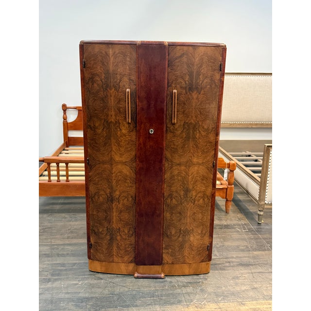 Design Plus Gallery presents an Art Deco Walnut Elm Door Wardrobe. The piece is so becoming with a modest silhouette that...
