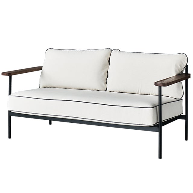 This sofa features a sleek and modern design, upholstered in polyester fabric. It has a clean and minimalist silhouette...