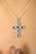 Exude grace and elegance with this stunning cross pendant, expertly crafted in 14K white gold. Featuring a total of 1.43...