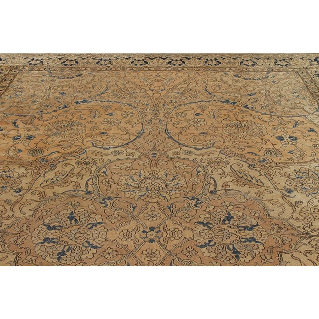 Hand knotted in wool originating from India circa 1890-1900, this 10x16 antique rug connotes a transitional Polonaise rug...