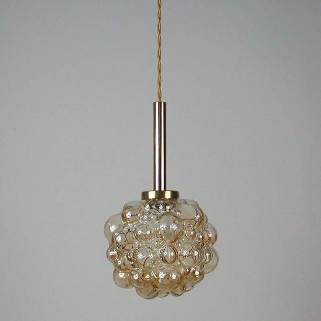 This Space Age pendant lamp was designed during the 1960s by Helena Tynell and Heinrich Gantenbrink and was produced by...