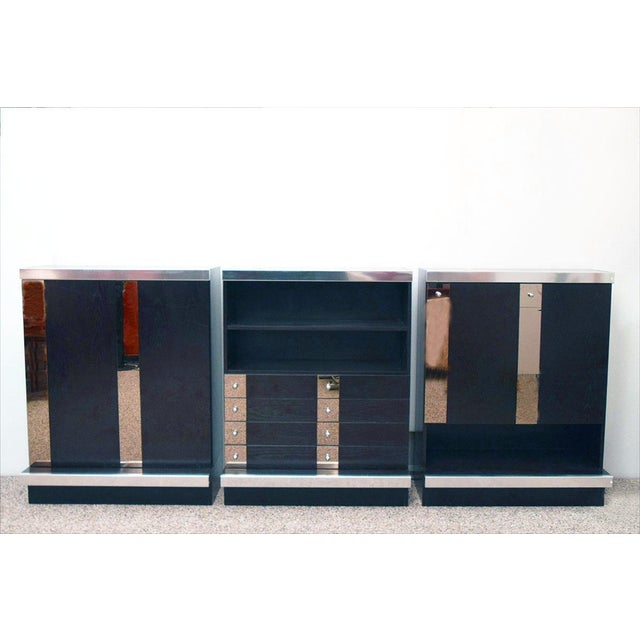 1970's modular sideboard attr. to Sormani. Made of three piecess in Wenghe wood and brunished mirror with steel details,...
