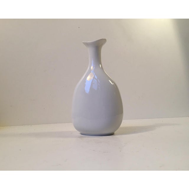 This Blanc de Chine vase was designed by the Swedish ceramist Gunnar Nylund for Hellerupis (Hellerup Ice Cream) in...