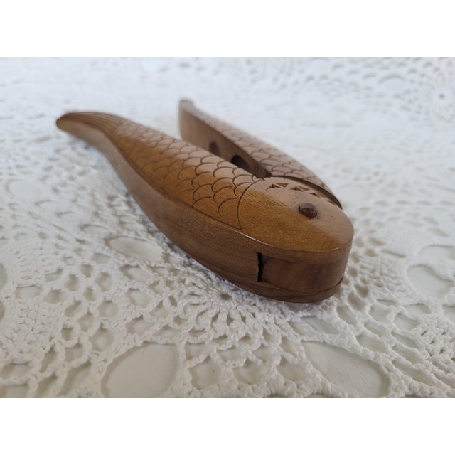A wooden mid century modern fish nutcracker with carved details. It measures 7 ½” x 2” x 1 ¼”. Wouldn't this make a fun...