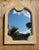 A fantastic vintage cerused pencil reed mirror featuring a beautifully sculptural arched frame with refined Postmodern...