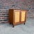 A beautifully crafted Mid-Century Modern cabinet from the highly collectible Wonderwood collection by American of...