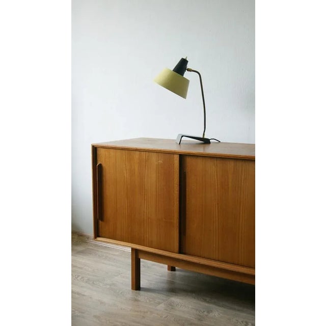 Elegant and functional table lamp, perfect for the office. Featuring a perfectly curved brass arm The shade in pastel...