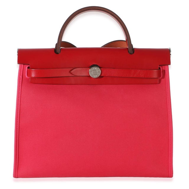 Item #: 154982 Exterior Material: Leather;Canvas Size: 31 Interior Material: Canvas Dimensions: 12 x 9.5 x 4 in Handbag...