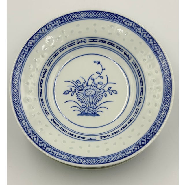 Elevate your table setting with the elegant Rice Flower series by Jingdezhen, a testament to fine Chinese craftsmanship....