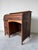 This antique solid wood roll top desk features the classic early 20th century design admired for both its practicality and...