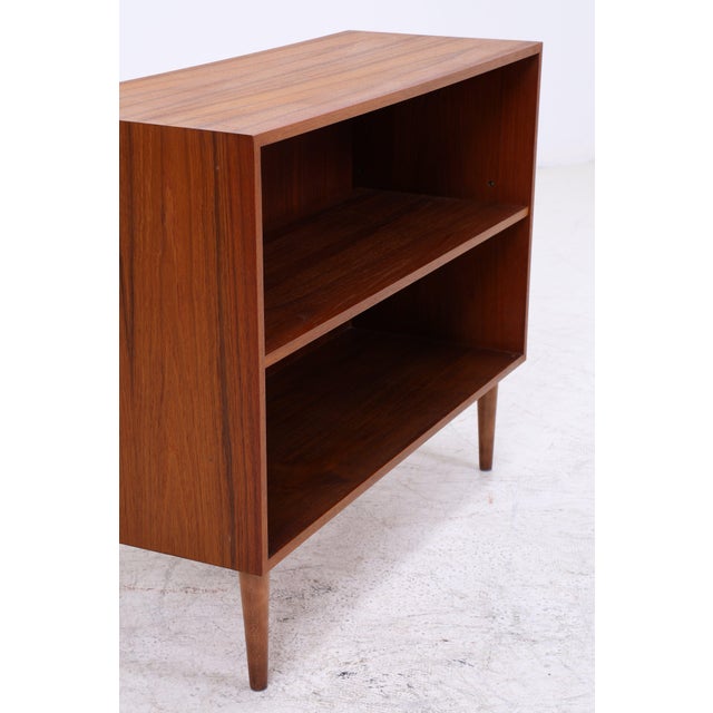 Vintage shelf from Musterring with clean lines and beautiful teak grain. The open design creates a light and airy feel and...