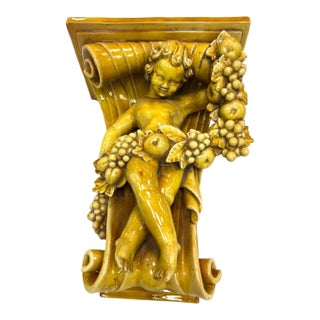 Early 20th Century Italian Baroque Revival Glazed Majolica Cherub Wall Bracket For Sale