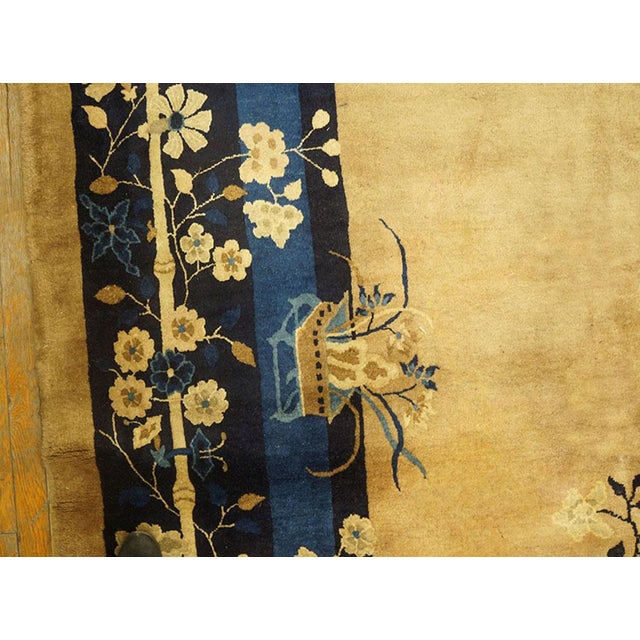Antique Peking Square Room Size Wool Rug, Circa Date: 1900s. This exceptional Chinese textile captures the refined...