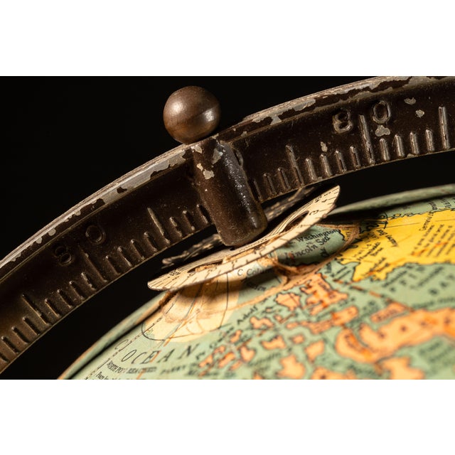 c. 1940s; Replogle Globes, Inc. - Chicago, IL Mid-century globe lamp made up of twelve chromolithographed paper gores laid...