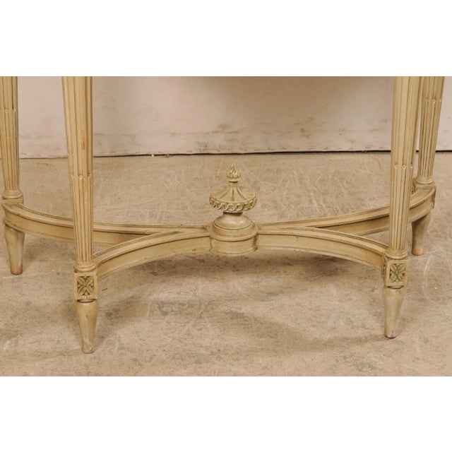 A French console table, with fabulous breche d'alep marble top, circa 1930's-40's. This antique table from France features...
