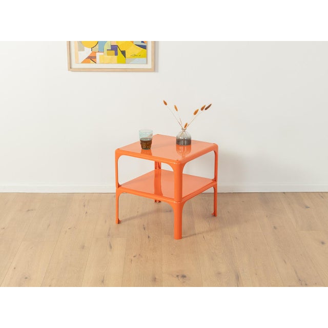 Stackable DEMETRIO 45 side tables by Vico Magistretti for Artemide from the 1960s. High-quality orange plastic frame....