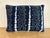 Decorative pillow crafted from an authentic indigo-dyed tribal textile, featuring rhythmic resist-dyed motifs and dotted...