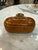 Beautiful vintage trinket box crafted from richly toned carved wood with an eye-catching segmented design reminiscent of...