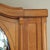A two-door oak wardrobe with an oval bevelled mirror, stylistically situated between late Art Nouveau and reform-oriented...