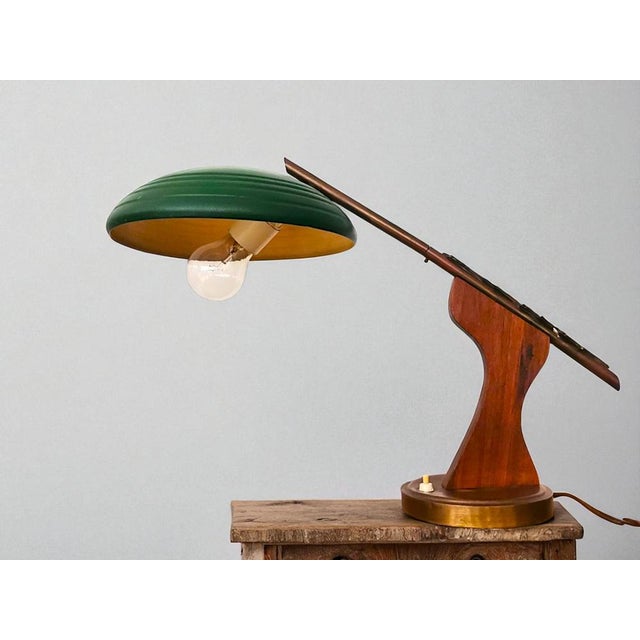 1950s-60s modernist design table lamp, similar in shape to President lamp by Fase. The shade is made of metal painted...