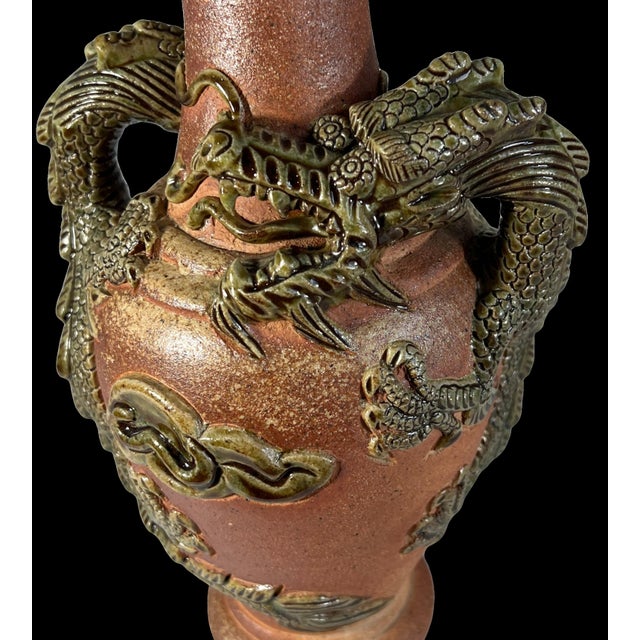 This impressive early 20th-century Japanese Tokoname-yaki style redware pottery vase is a striking example of Asian...