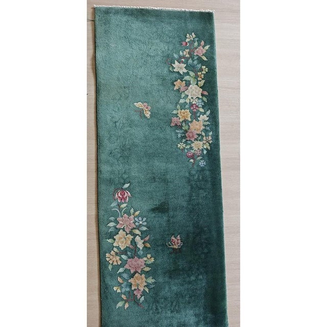 Green Color Antique Art Deco Chinese Small Scatter Size Throw Rug (2.02ft x 6ft), Circa Date: 1920s. This exquisite piece...