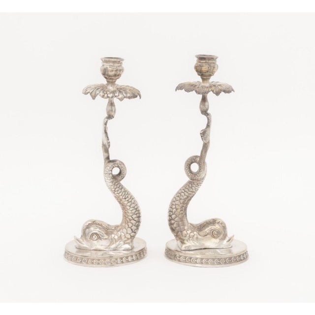 Pair of Baroque Style Dolphin Form Silver Plate Candlesticks. 10.5" H x 4.5" W x 3.5" D. Provenance: From a Brooklyn...