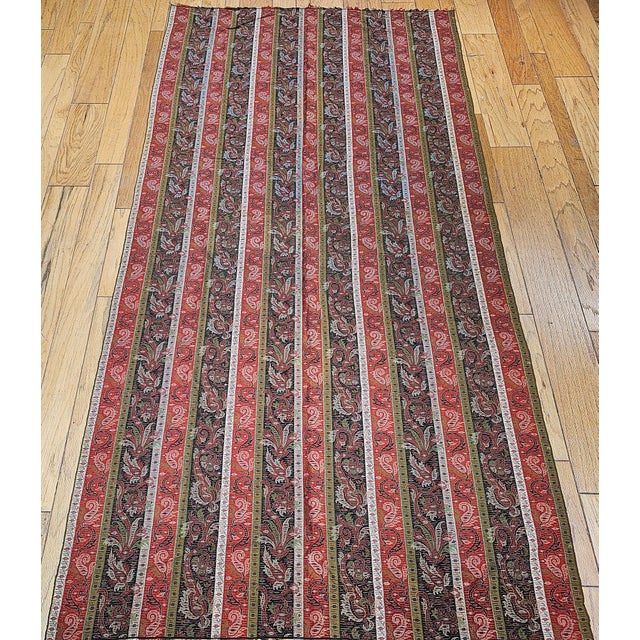 A rare and exquisitely preserved mid-19th century hand woven Kashmiri shawl from Northwest India, showcasing a richly...