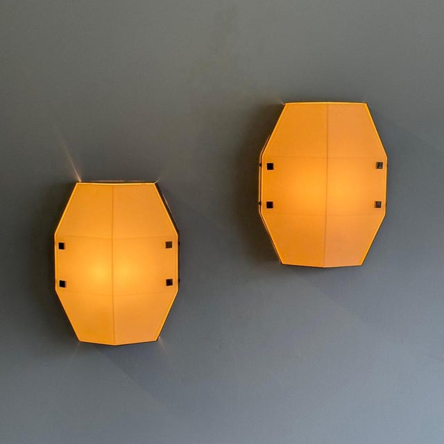 These sculptural wall lights perfectly express the refined balance between architectural rigor and material warmth that...