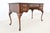 Solid cherry Queen Anne–style writing desk by Ethan Allen, featuring three drawers with polished brass pulls....