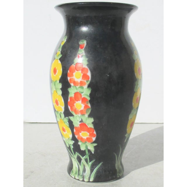 Classical Art Deco pattern and classic color scheme of red, yellow, green on black. Hollyhocks on a black ground with...