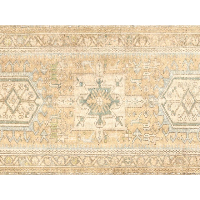 This vintage Persian Karadja runner measures 2'8" x 12'11" and features an intricate design and high-quality...