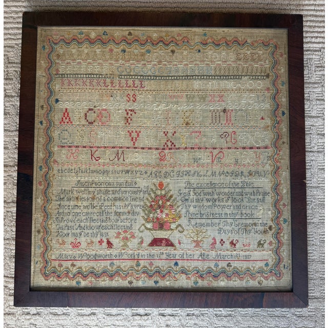 Stunning antique needlework sampler signed and dated, c. 1837. The sampler features decorative alphabet embroidery, an...