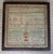 Stunning antique needlework sampler signed and dated, c. 1837. The sampler features decorative alphabet embroidery, an...