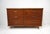 A very well crafted Mid Century six drawer dresser chest with chromed sculptural bowed pulls to each drawer front . The...