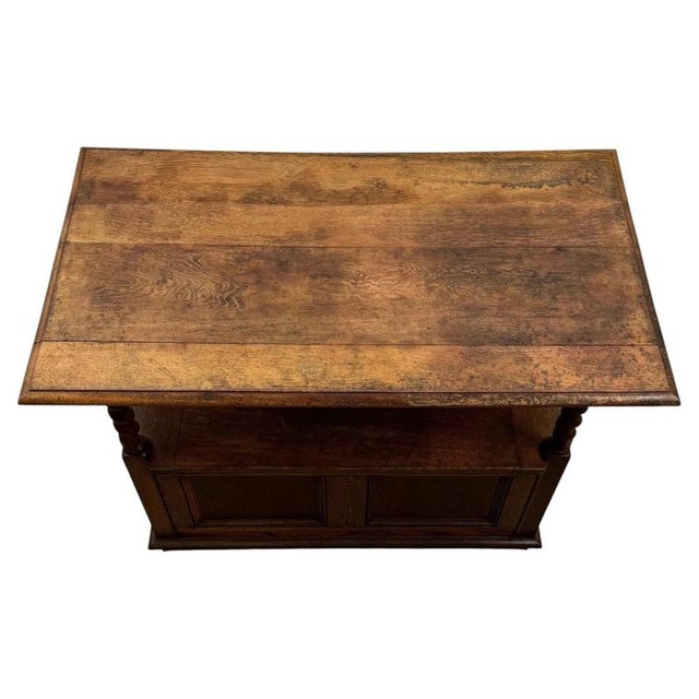 A handsome early 20th-century English monk’s bench, finely crafted from golden oak and distinguished by its ingenious...