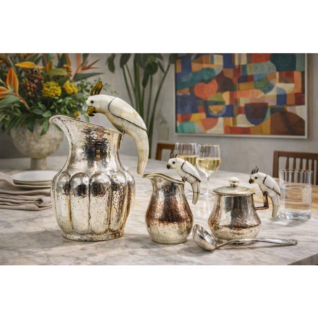 An exceptional four-piece modernist serving set designed and produced by Los Castillo of Taxco, Mexico, circa 1960s. This...