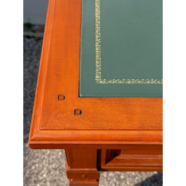 Cherry wood desk, made by Selva in Italy, 1960s. Truncated pyramid legs, simple lines, and three-part tops upholstered in...