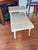 Vintage 1950's Mid Century 2 Tier Blonde Step Table with Laminated Top and Tapered Gold Tone Tipped Legs. This table is in...