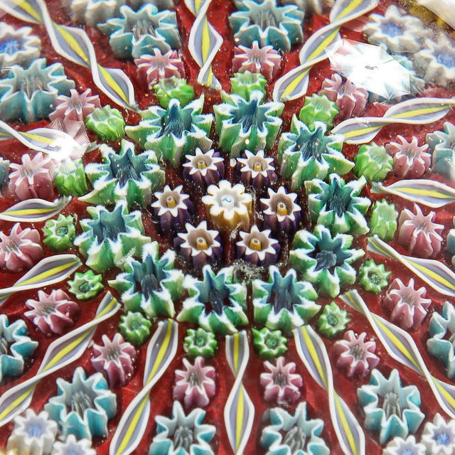 This exquisite Mid-Century Modernist hand-blown Murano glass paperweight, crafted in Italy circa 1960, exemplifies the...