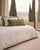 The contrasting chromatic scheme characterizing these couple of cushions lends it a distinct luxe yet restrained allure....