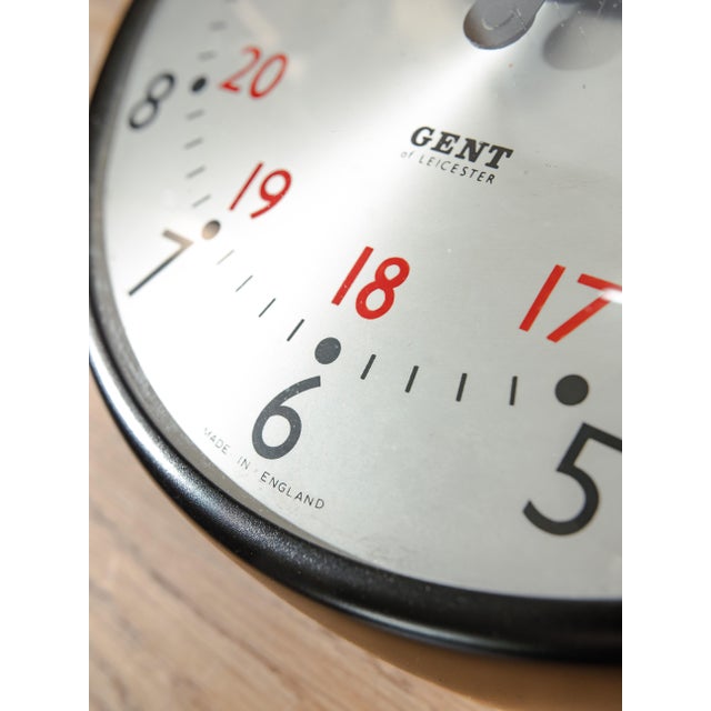 An original 1960s wall clock marked Gent of Leicester on the dial, finished in satin black and left with its original...