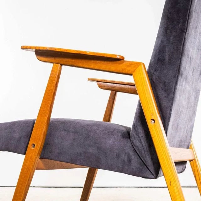 1950’s Mid Century Upholstered Grey Armchair with Straight Arms and Top Caps. Sourced in Scandinavia these are fully...