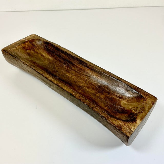 This is a lovely hand carved wooden Dough Bowl from France. It dates back to the Late 19th Century and is rectangular in...