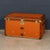 A rare early 20th century courier trunk by louis vuitton, covered in distinctive orange vuittonite canvas. Produced at a...