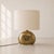 Large 1970s Italian table lamp crafted from solid cast brass, complete with an oval lampshade. The base features a...