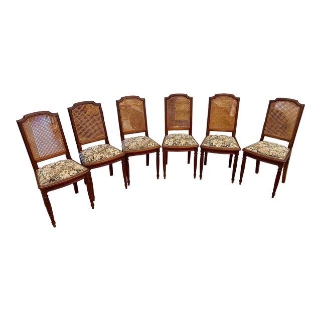 1970s French Louis XVI Walnut Cane Back Dining Chairs Set of 6 For Sale