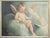 : Pair of antique oil paintings on canvas depicting winged cherubs in a joyful pose. The cherub in the foreground is...